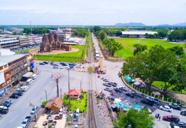 railway-near-historic-sites-with-parked-car-waiting-train-run-pass_40185-167